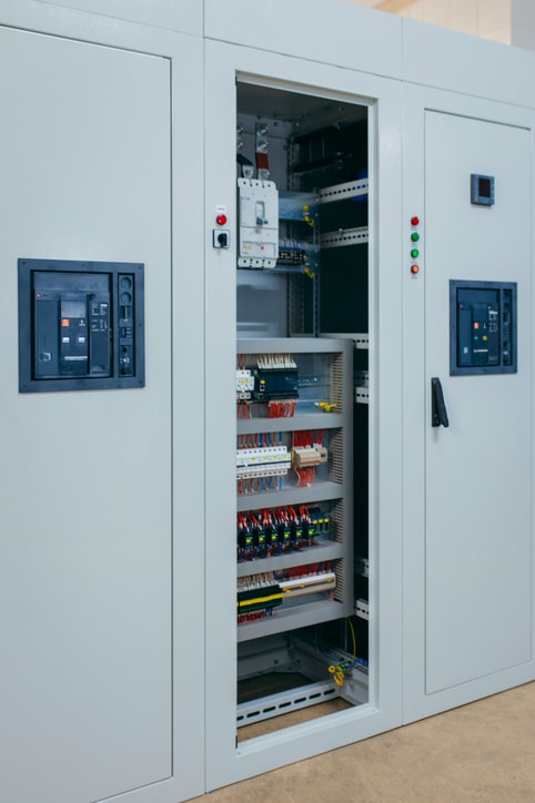 Industrial electrical control panel open view showing internal wiring, components, and terminal layout